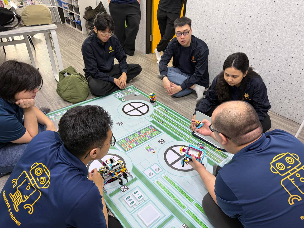 NK Robotics teachers practising hands-on on the competition mat